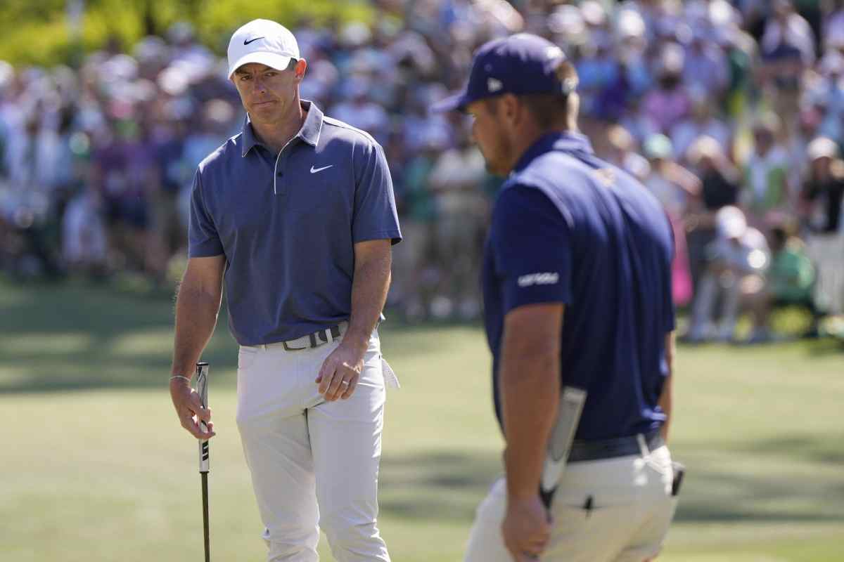 McIlroy e DeChambeau sul green